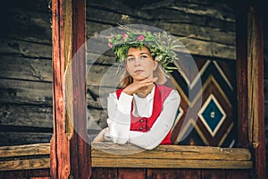 Latvian woman in traditional clothing. Ligo folk.