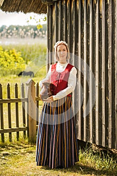 Latvian woman in traditional clothing. Ligo folk.