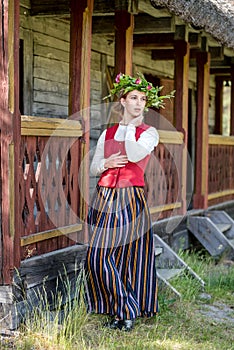 Latvian woman in traditional clothing. Ligo folk.