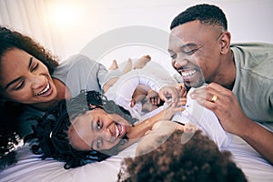 Laugh, tickle and morning with black family in bedroom for wake up, bonding and affectionate. Weekend, smile and care