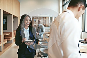 African American businesswoman laughing after a meeting with off