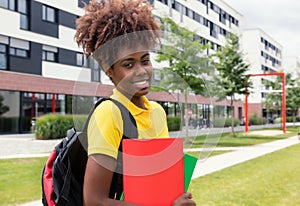 Laughing african american female student outdoor on campus