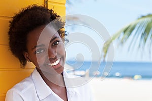 Laughing african american girl near beach