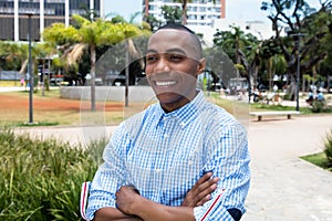 Laughing african american man with crossed arms