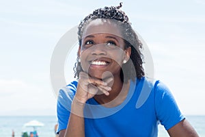 Laughing african american woman in a blue shirt