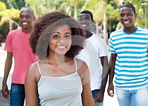 Laughing african american woman with friends from Africa