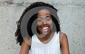 Laughing african american woman looking at camera