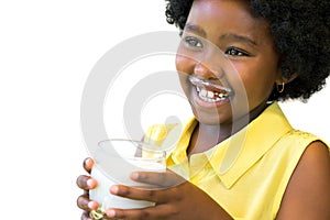 Laughing african kid with milk glass.