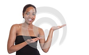 Laughing african woman presents something