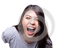Laughing asian woman. Beautiful young asian girl laugh someone with mockery or sneer. Young lady is cheerful woman. She hear joke photo