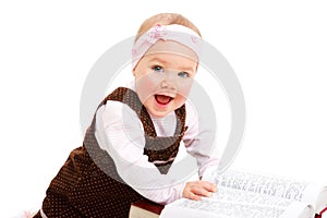 Laughing baby with book