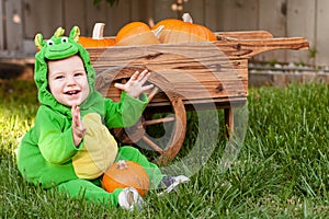 Laughing baby in dragon Halloween costume