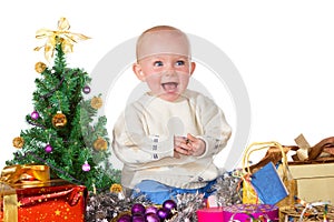 Laughing baby surrounded by Christmas gifts