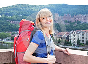 Laughing backpacker blonde hair in Heidelberg