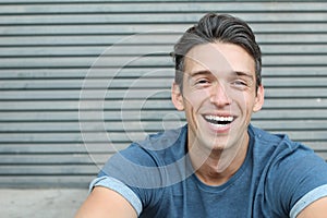 Laughing big white smile perfect straight teeth dental patient headshot male youthful genuine