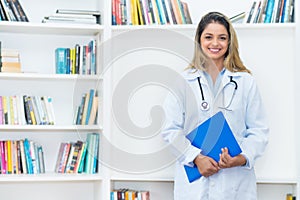 Laughing blond female scientist researching for vaccine against coronavirus