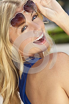 Laughing Blond Woman In Heart Shaped Sunglasses