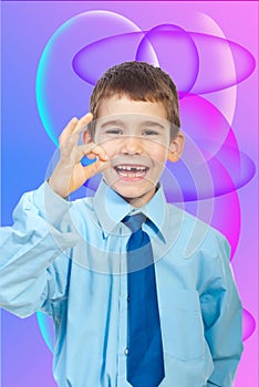 Laughing boy showing okay sign gesture