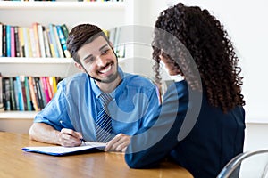 Laughing brazilian businessman at job interview