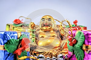 Laughing Buddha with attractive smile and gifts