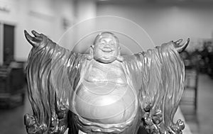 Laughing buddha open arms