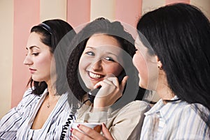 Laughing business woman speaking at phone