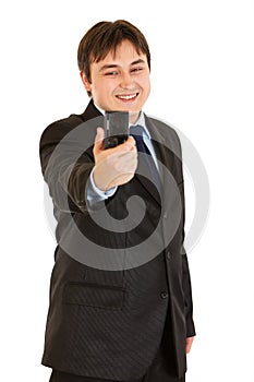 Laughing businessman photographing himself