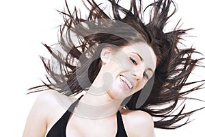 Laughing carefree woman l tossing her hair