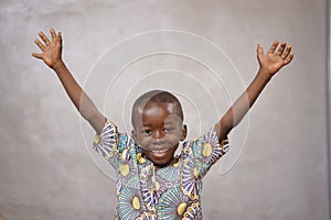 Laughing Cheerful African black boy is Incredibly Happy with Copy Space photo