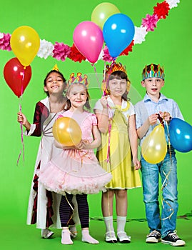 Laughing children with balloons