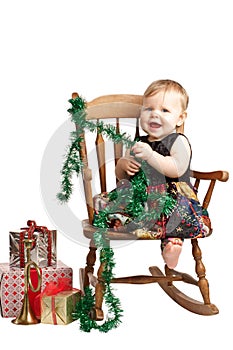 Laughing Christmas baby rocks in patchwork dress