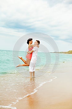 Laughing couple at the beach