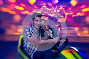 Laughing couple in bumper car - shoot with lensbaby photo