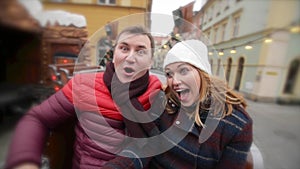 Laughing Couple Having Fun in the Attraction on the Christmas Market, Young Family Laughing in the Xmas Fair. Merry