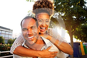 Laughing couple with man and woman in embrace