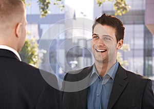 Laughing coworkers outside of office