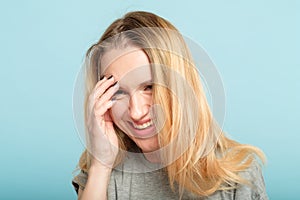 Laughing embarrassed woman cover facepalm shame photo