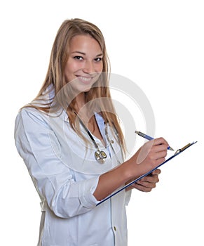 Laughing female doctor with blond hair and clipboard