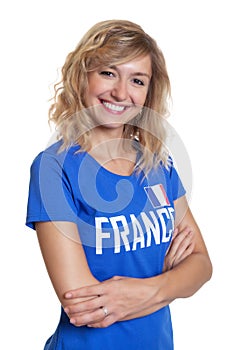 Laughing french sports with blond hair and blue jersey