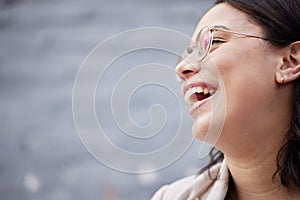 Laughing, funny and face of a woman with a smile for happiness, motivation and positive mindset. Closeup, zoom and a