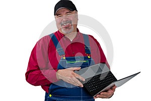 Laughing genial worker or farmer with laptop photo