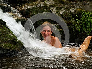 Laughing girl bathing