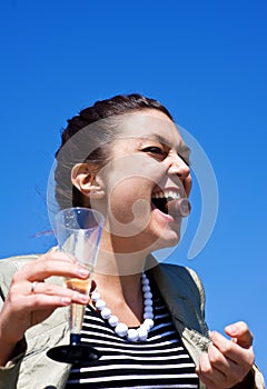 Laughing girl with candy in her mouth