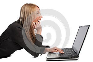 Laughing girl with laptop, isolated