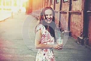 Laughing girl with milk shake