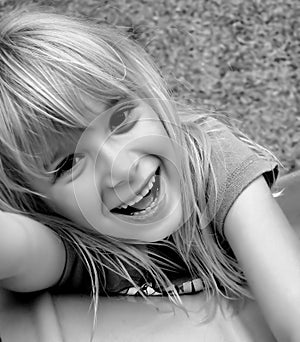 Laughing girl on slide