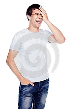 Laughing guy with hand on face