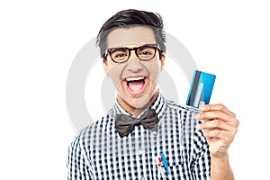 Laughing guy holding credit card