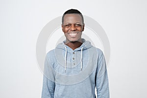 Laughing handsome young african man smiling confident