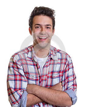 Laughing hispanic guy with crossed arms